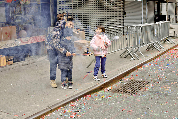 Father & kids at Chinatown Lunar New Year Parade - NYC, 2023