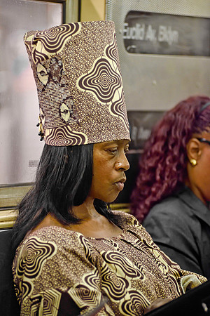 African attired woman aboard E train - NYC, 2015